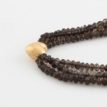 Ole Lynggaard,  smoky quartz necklace, clasp gold heart.