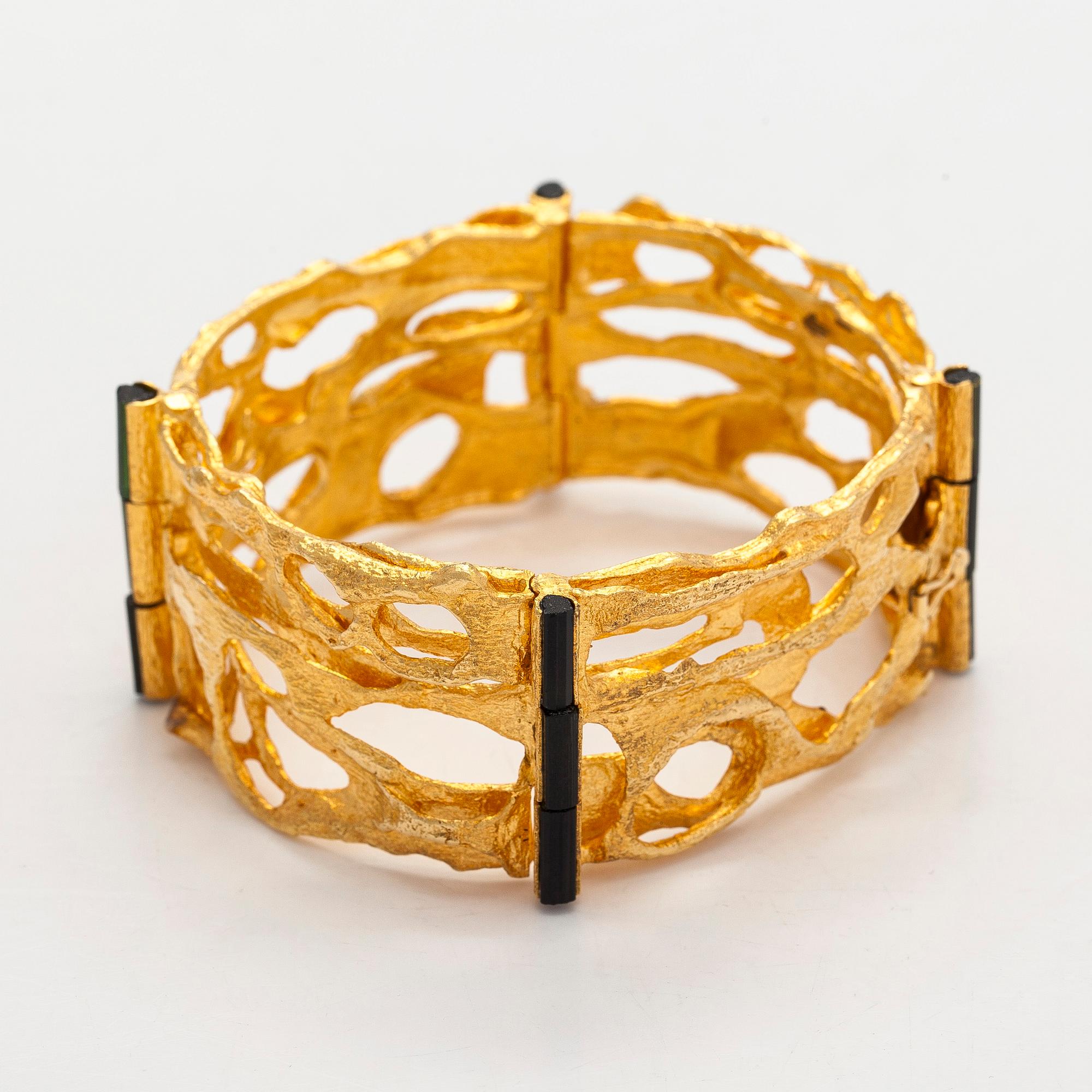 Björn Weckström, an 18K gold and tourmaline 'Sacrificial fire' bracelet. Lapponia 1971.
