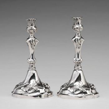 A pair of Swedish 18th century rococo silver candlesticks, mark of Jacob Lampa, Stockholm 1772.