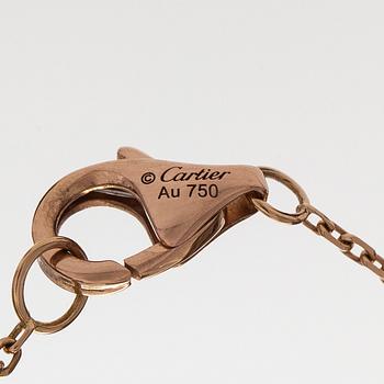 Cartier, an 18K gold 'Trinity Pendant' necklace with a brilliant-cut diamond.