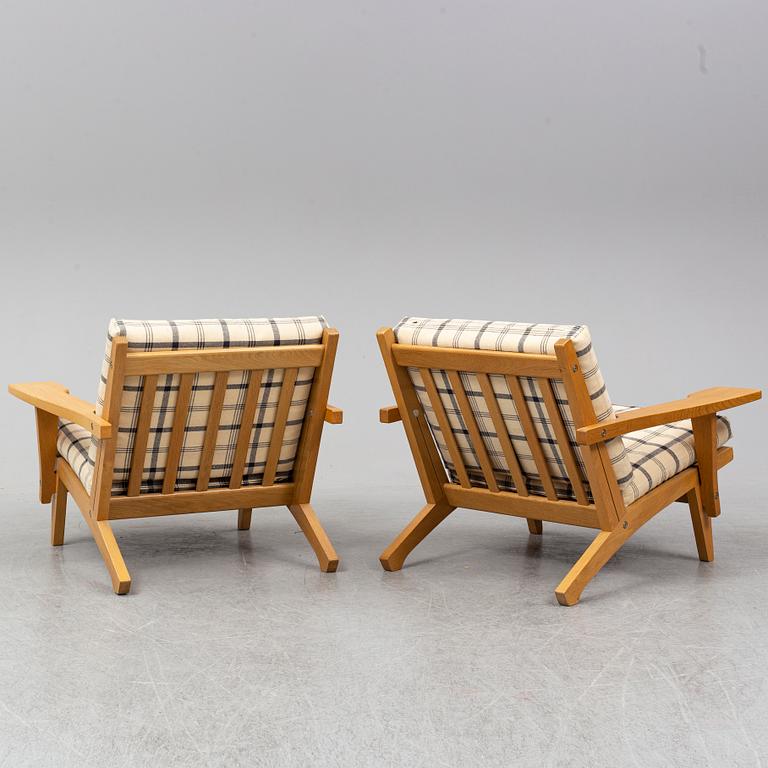 HANS J WEGNER, a pair of oak easy chairs, Getama, Denmark.