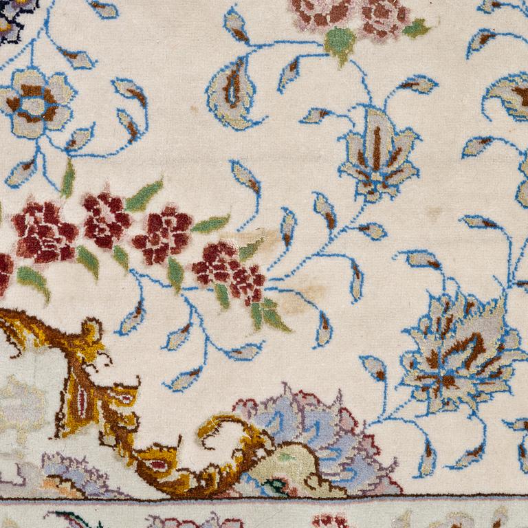 A Tabriz carpet north west Persia, part silk, c. 314 x 197 cm.