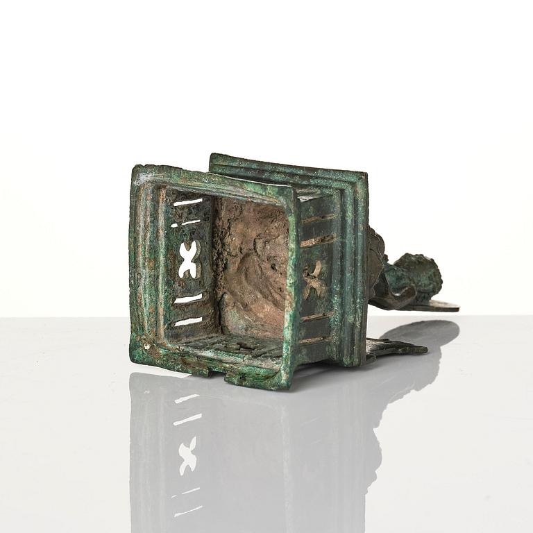 A bronze Buddha Vairocana, Eastern Java, 10th century.