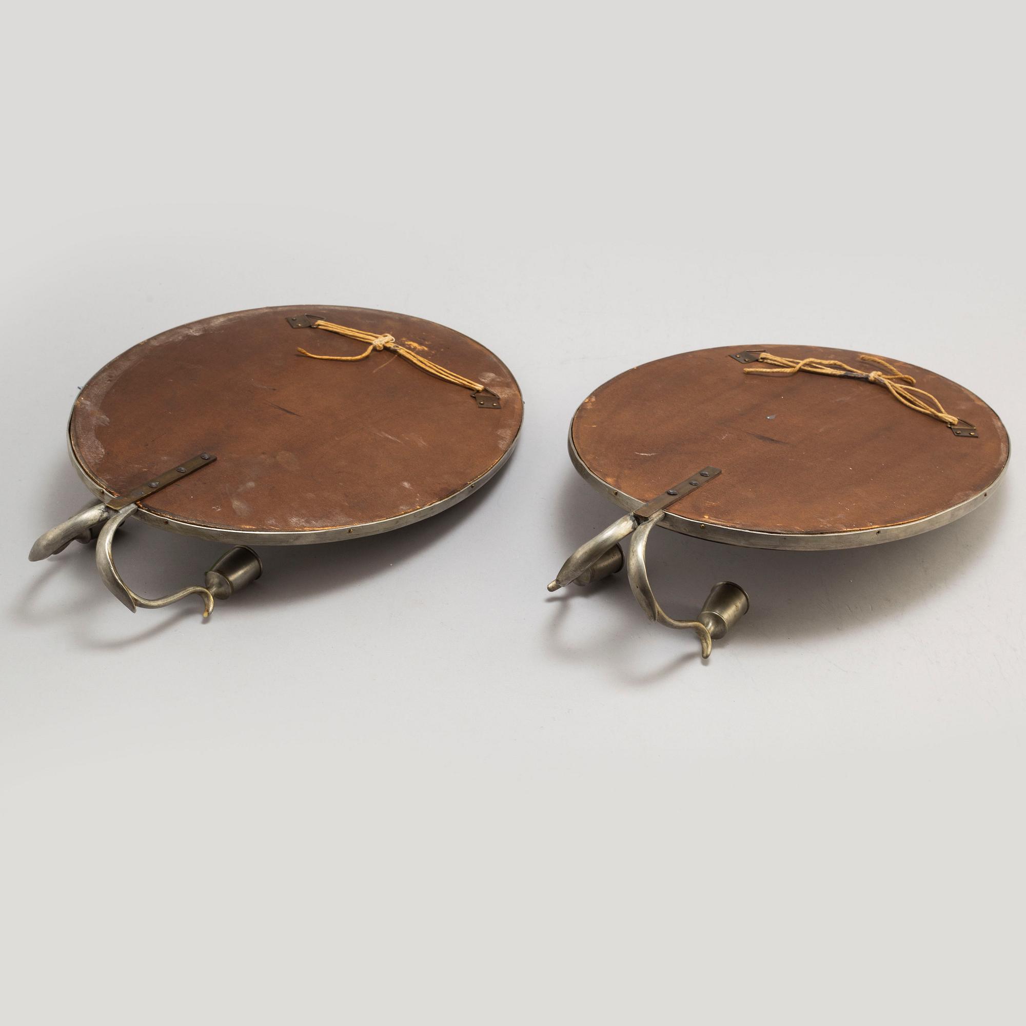 A pair of pewter wall sconces, Firma Svenskt Tenn, model no 245, Stockholm 1928.