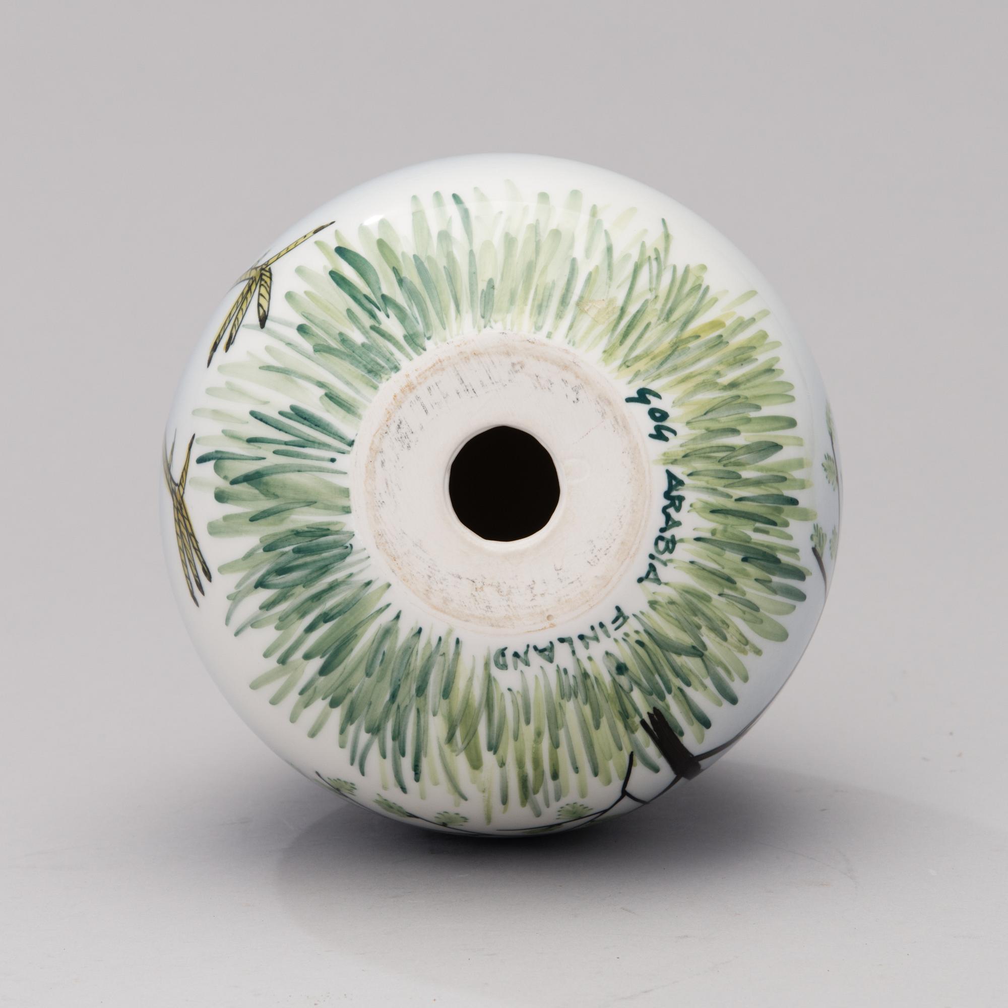 A porcelain egg signed GOG Arabia Finland.