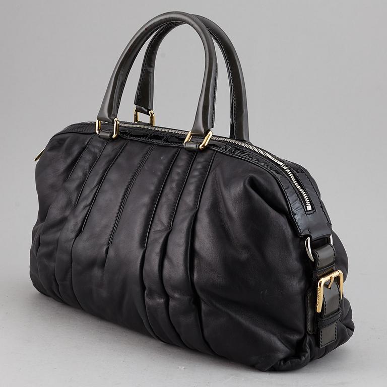 DOLCE & GABBANA, a black leather bag.