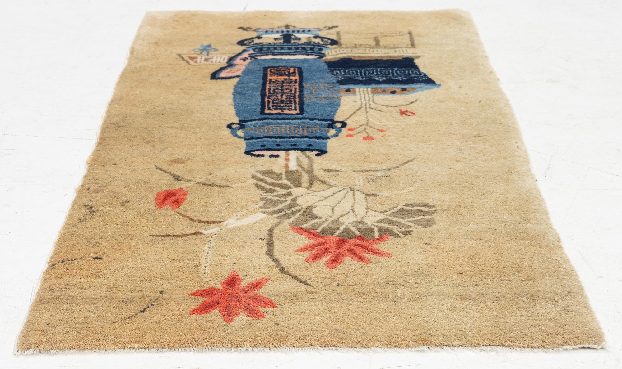An antique Baotou rug, China, c. 127 x 66 cm.