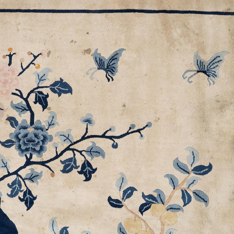 A semi-antique pictoral Chinese rug, approx. 240 x 170 cm.