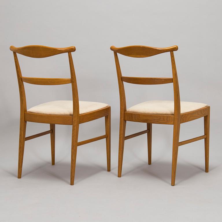 A set of four 1960s oak chairs.