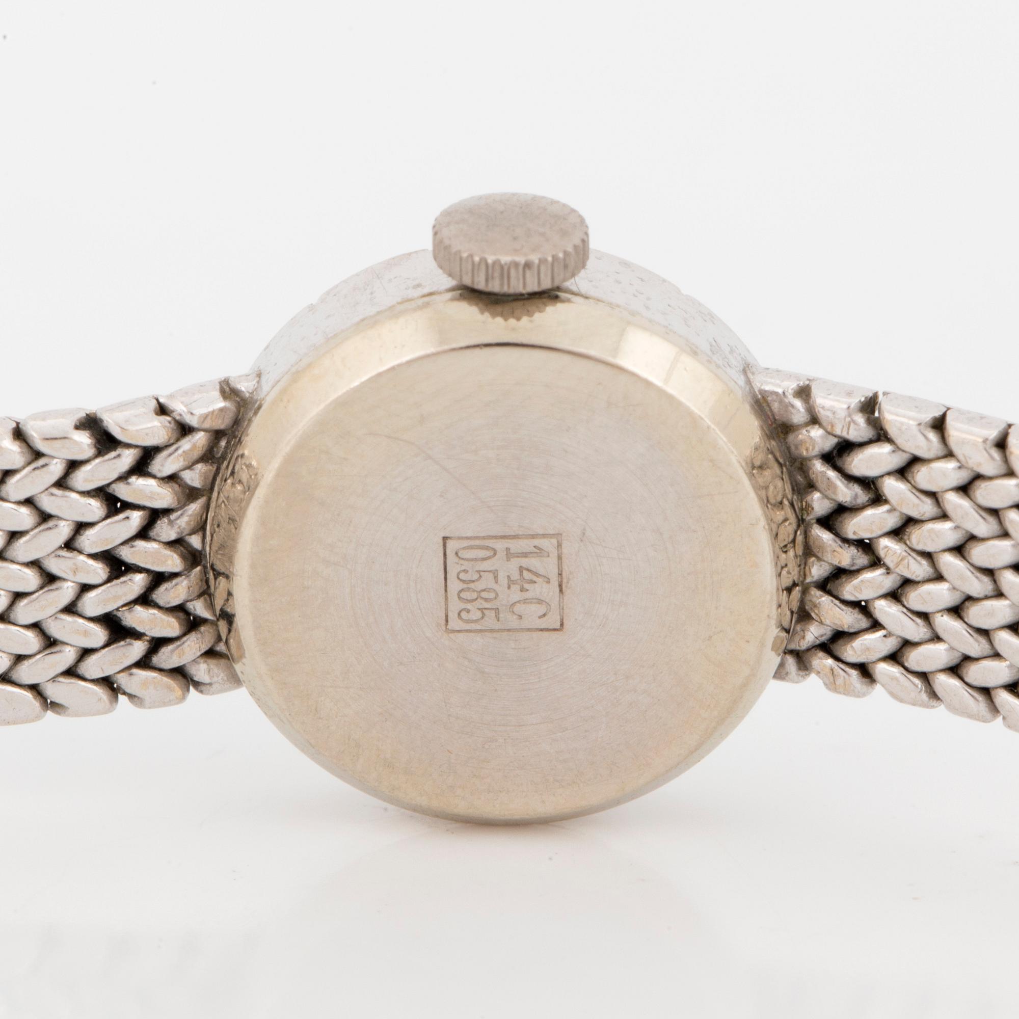 A ladies watch  "Exquisit".14K white gold with diamonds.