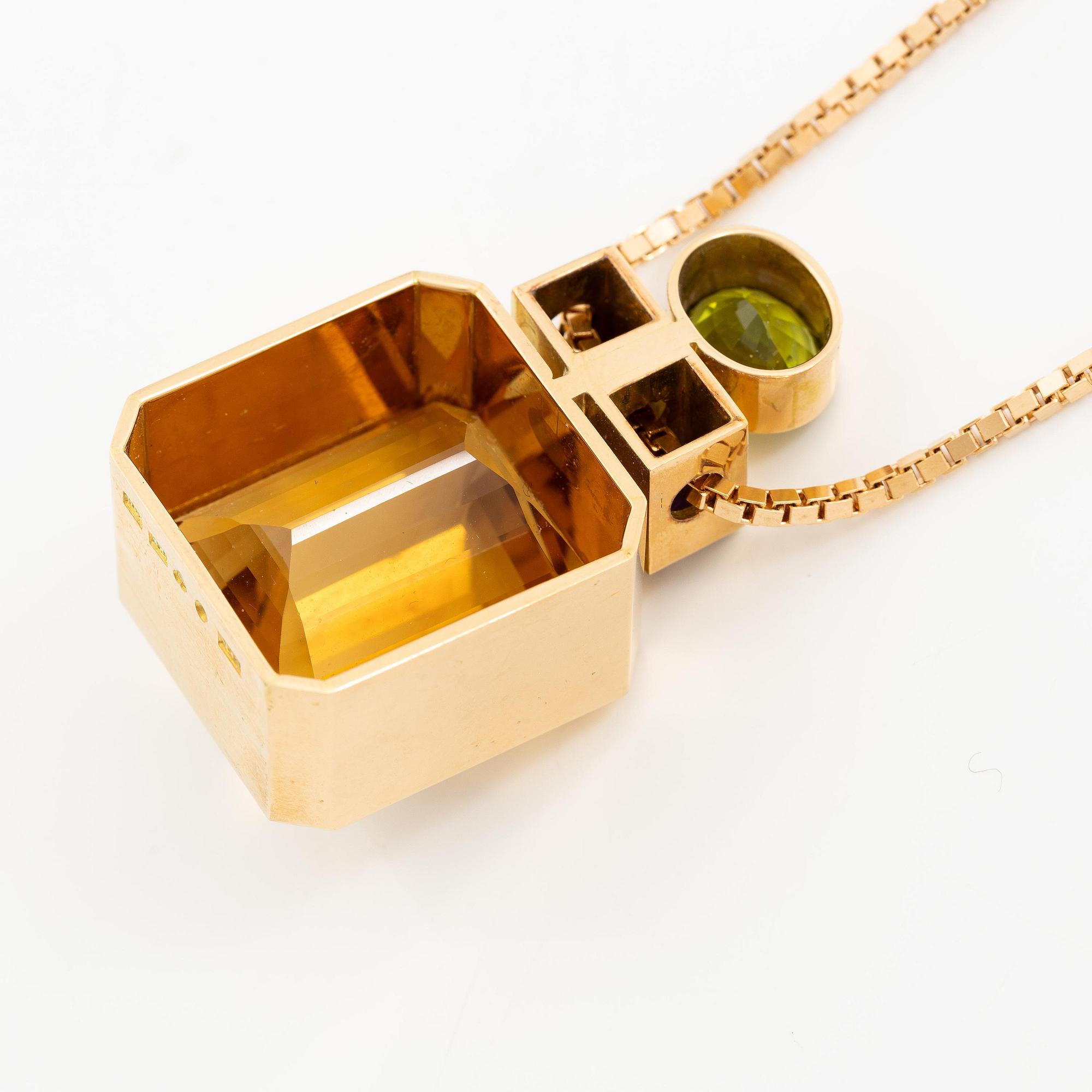 Kristian Nilsson, hänge 18K guld med en fasettslipad citrin, ametist pch peridot. Stockholm, 1986.