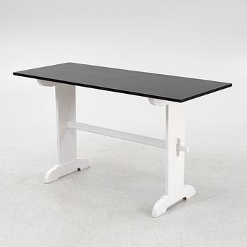 A painted table, 20th Century.