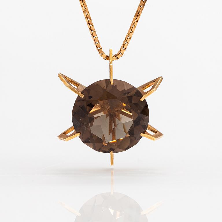 A 14K gold necklace with a smoky quartz. Martti Tapio Aarnio, Helsinki 1966.