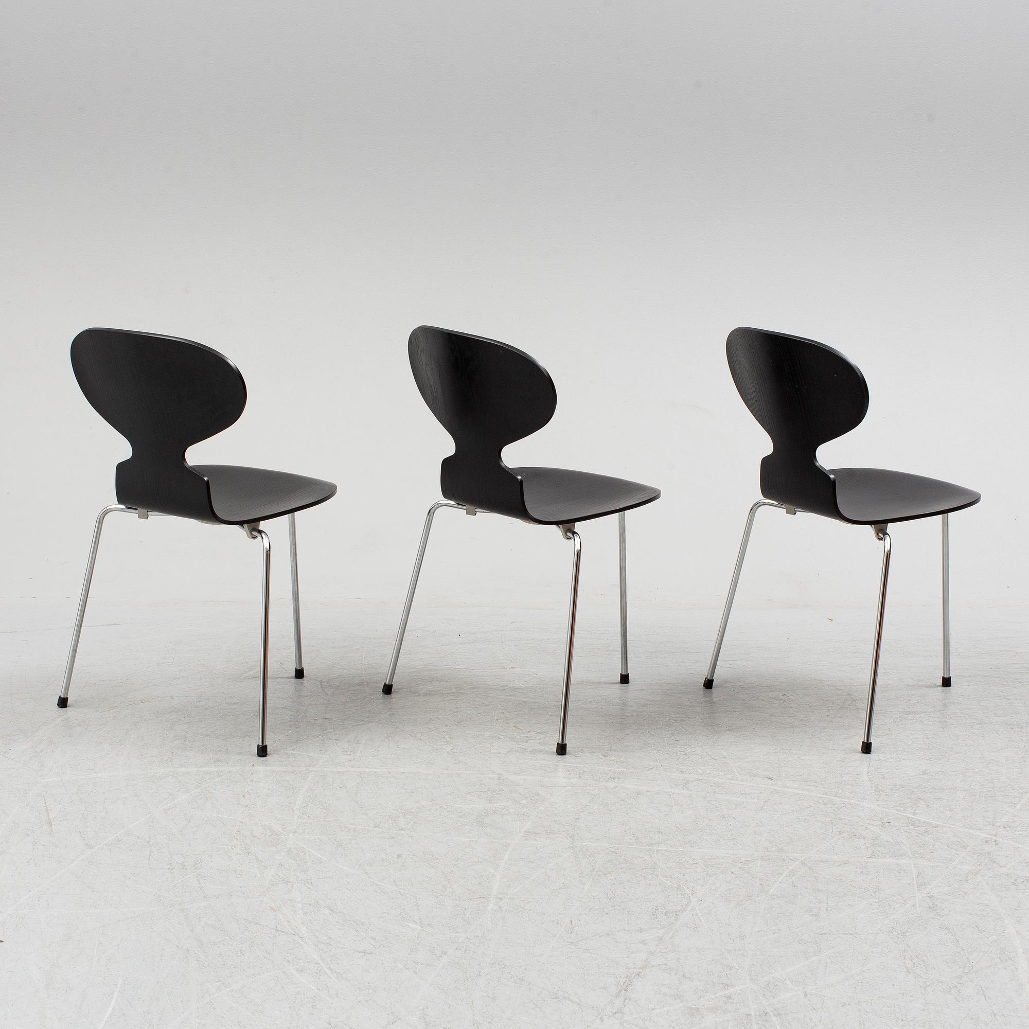 An Arne Jacobsen "Centenary Package" comprising three "Ant Chairs" and an eggshaped table, Fritz Hansen, Denmark.