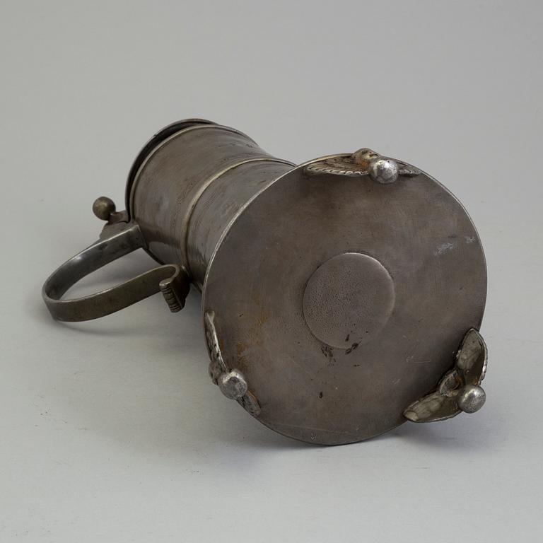 A PEWTER MUG, dated 1776.