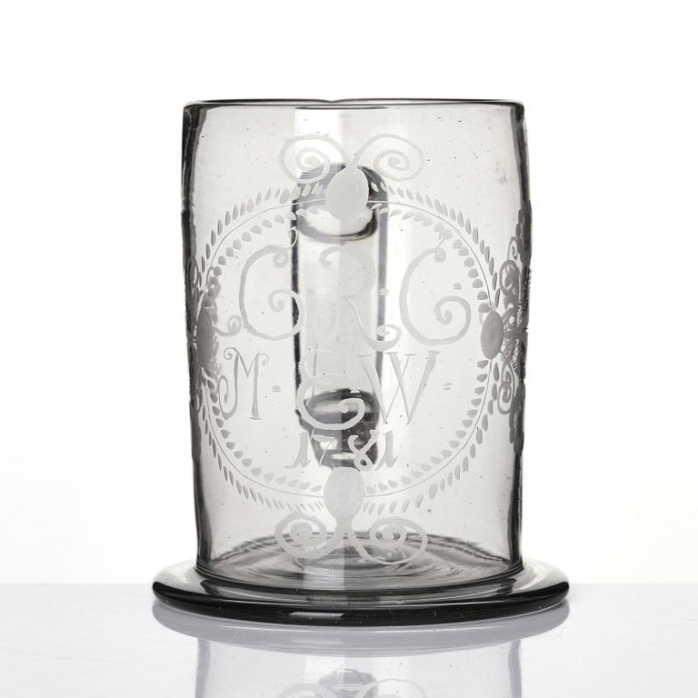 A large tankard, 18th Century with eched monogram for 'G.R.G' and 'M.E.W.' 1781.