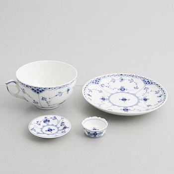 20-pieces of a half lace "Musselmalet" porcelain tea service, Denmark, of varying dates of manufacture, 20th century.