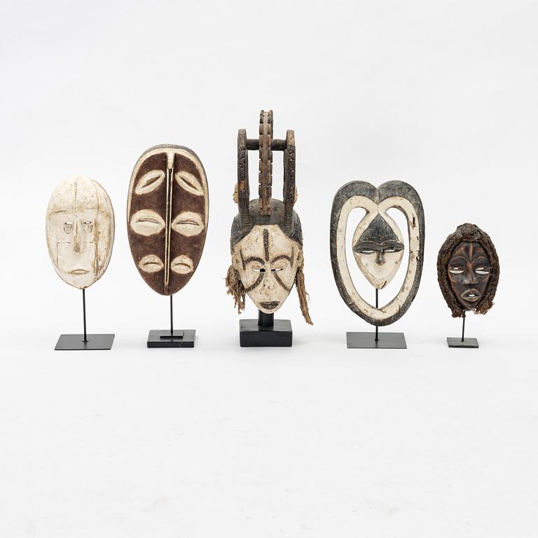 Five mask reportedly from Kwele, Gabon, Fang, Gabon, Bakwele, Gabon,  and moore,from the second half of the 20th century.