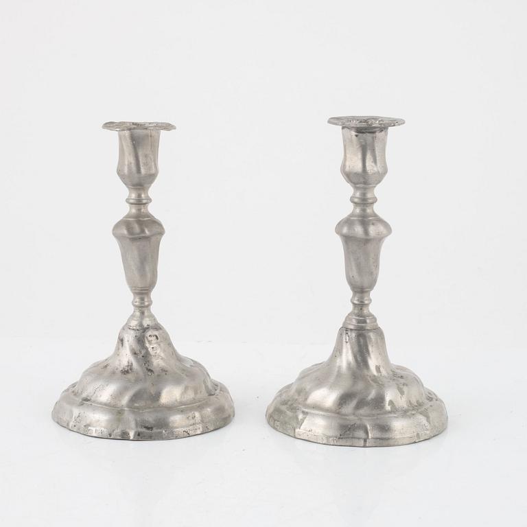 A pair of rococo pewter candelsticks, mark of J. Hassel, Enköping 1775.