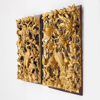 Two carved gilded wooden panels, Qing dynasty, circa 1900.