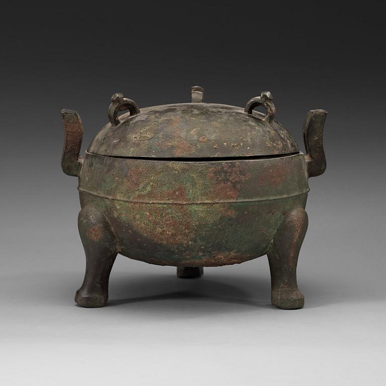 A bronze ding tripod censer with cover, presumably Han dynasty (206 BC - 220 AD).