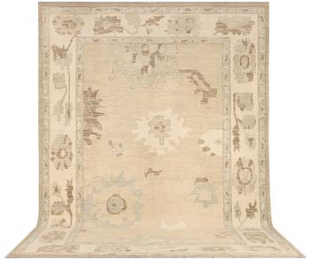 An Ushak design carpet, c. 442 x 317 cm.