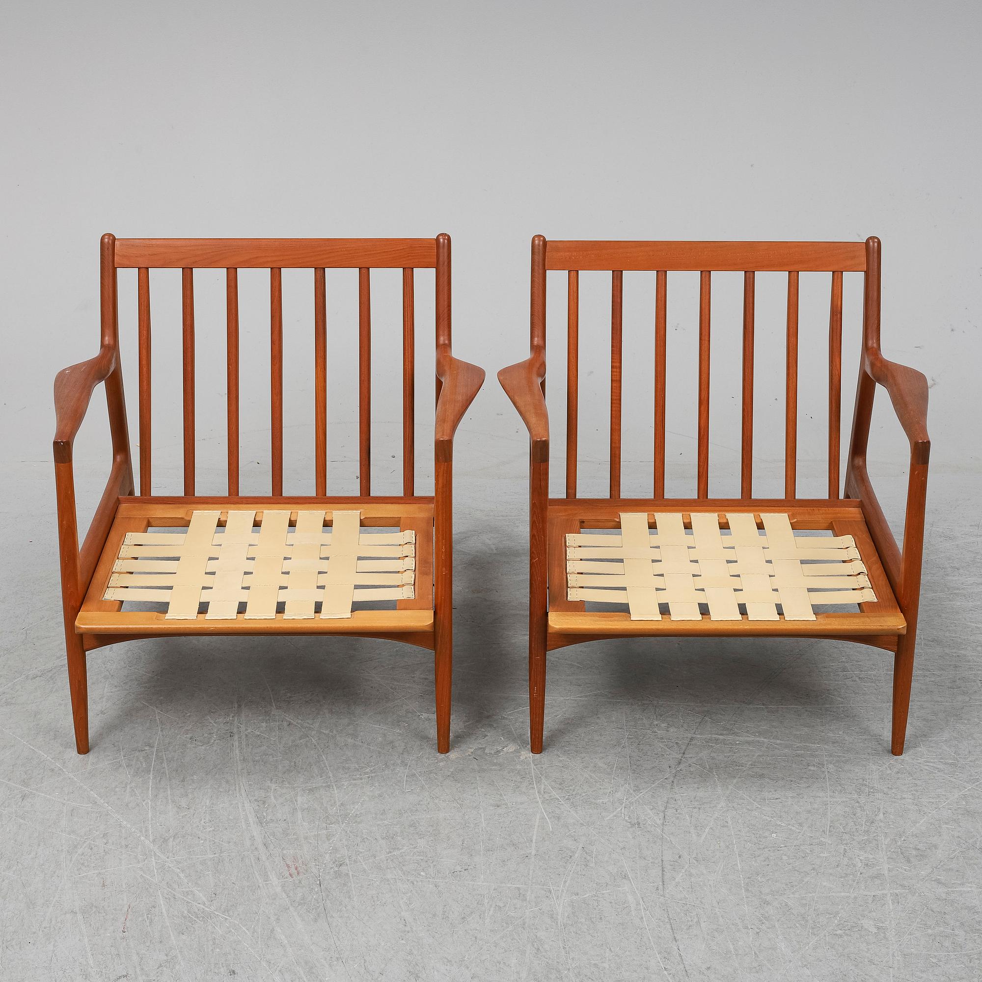 A pair of late 20th Century easy chairs.