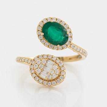 Emerald and diamond cross over ring.