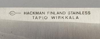 A Finnish puukko knife in stainless steel, nylon and brass designed by Tapio Wirkkala, Hackman Finland.