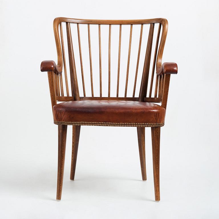 Otto Schulz, a Swedish Modern stained beech and cognac coloured leather armchair.