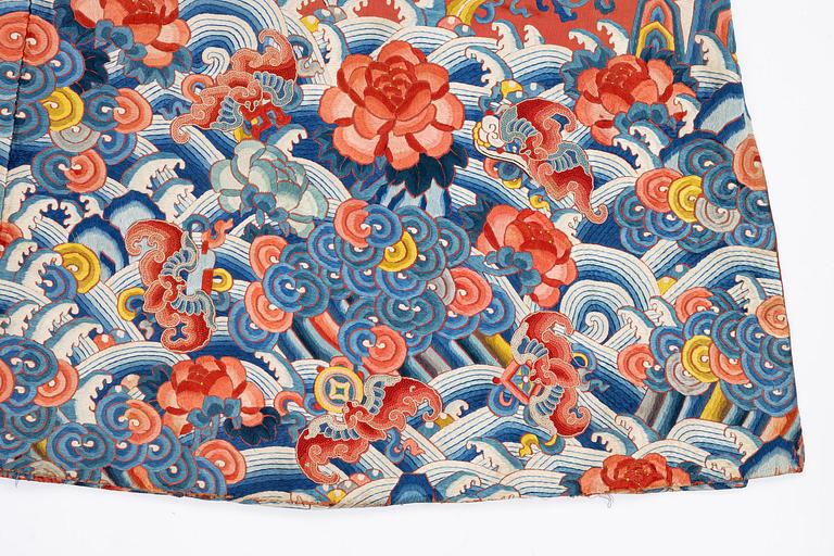 An embroidered red ground five clawed dragon 'female' formal robe, Qing dynasty, 19th century.