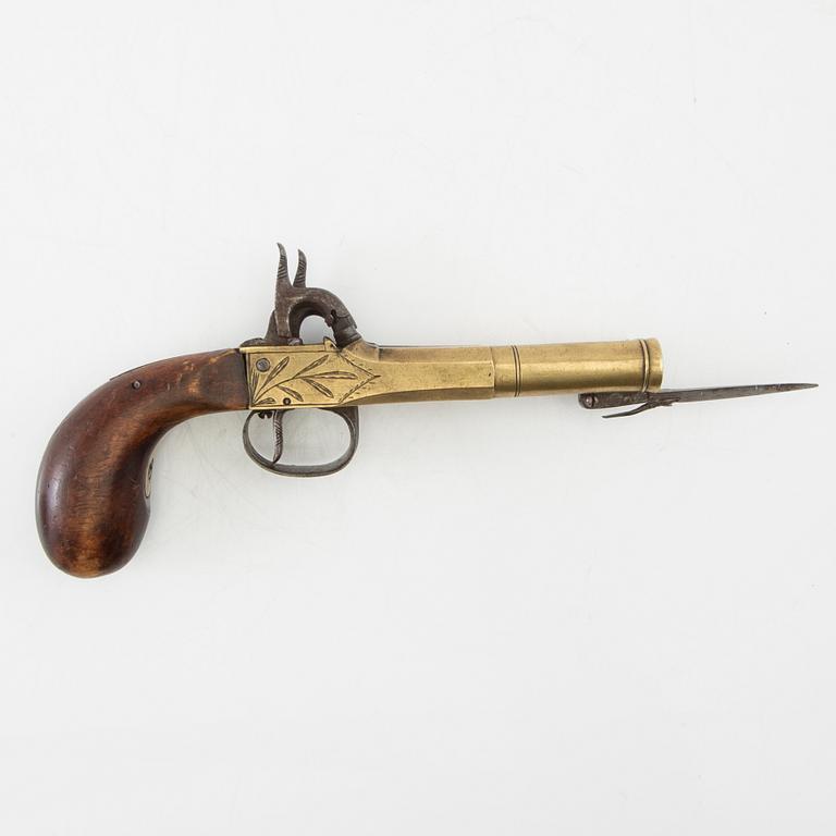 Double-barrel percussion pistol with bayonet, 19th century.