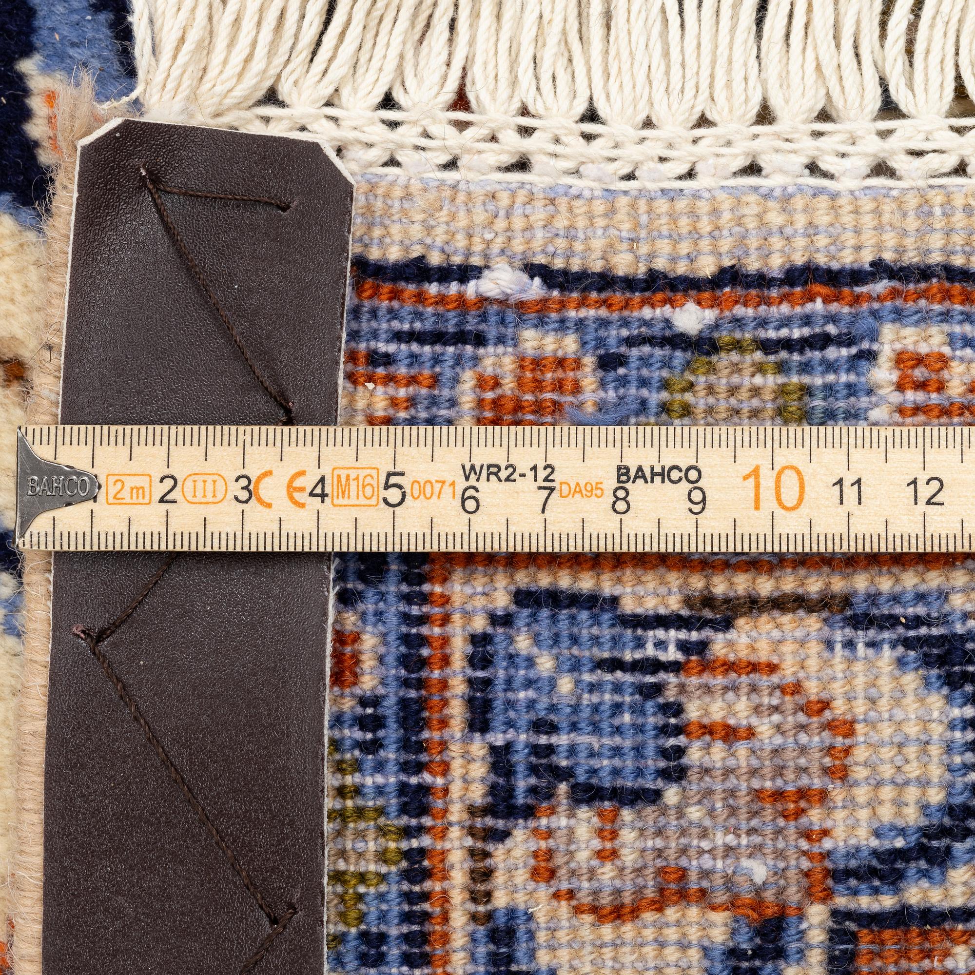 A Najafabad carpet, c. 335 x 255 cm.