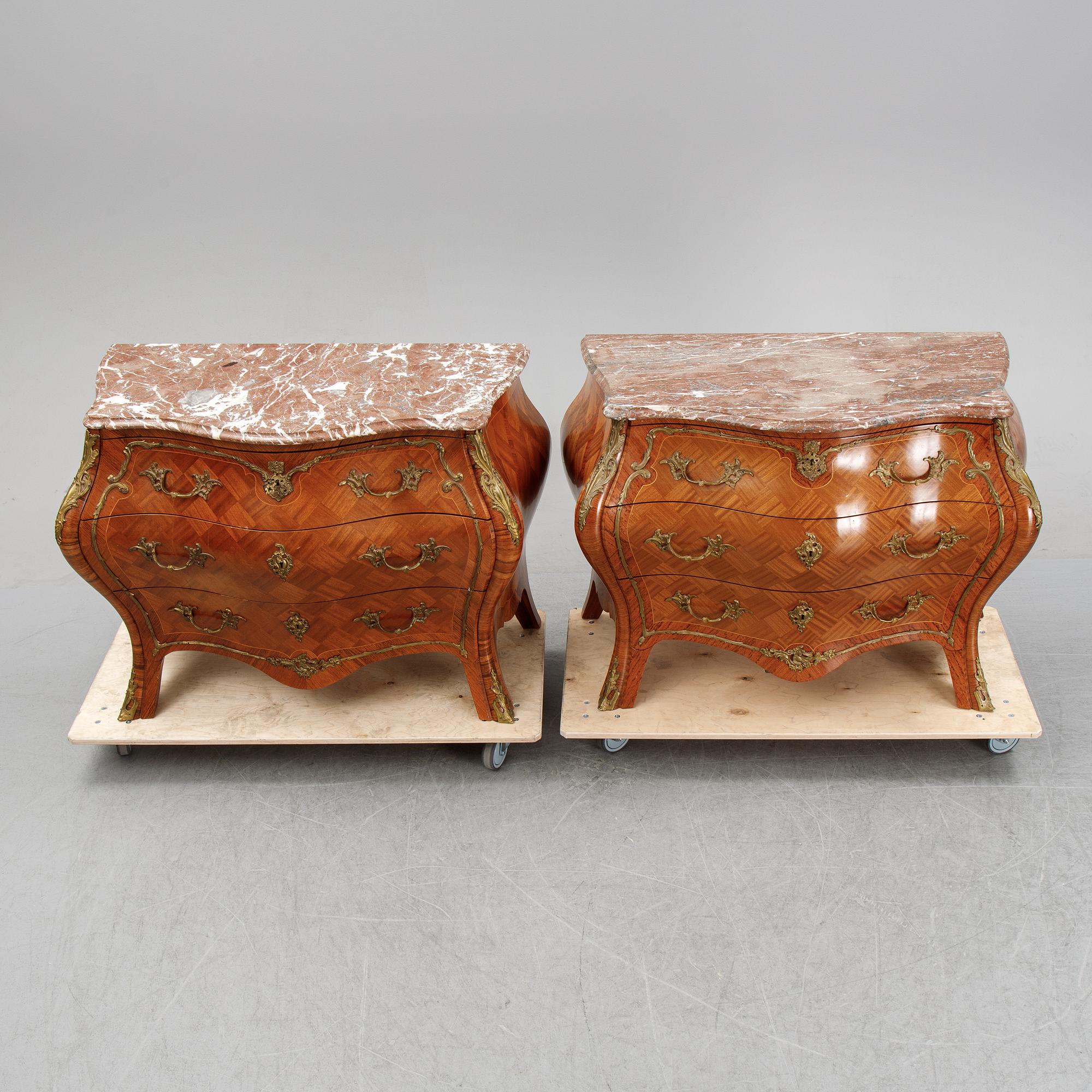 A pair of rococo style chest of drawers, mid 20th Century.