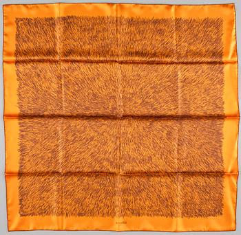 427. A silk scarf "Touch me" by Hermès.