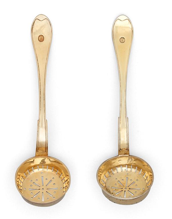 A pair of Swedish 19th century silver-gilt sugar-spoons, makers mark of Gustaf Folker, Stockholm 1824.