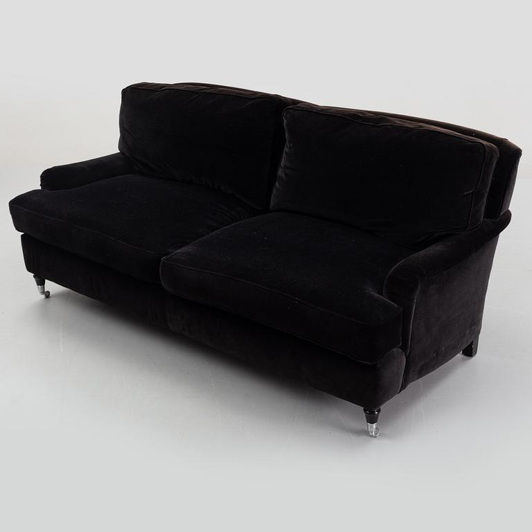 A contemporary velvet Howard sofa.