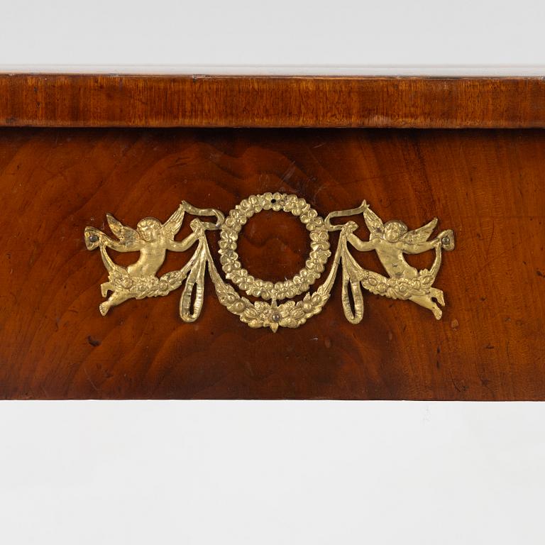 An empire console table, firts half of the 19th century.