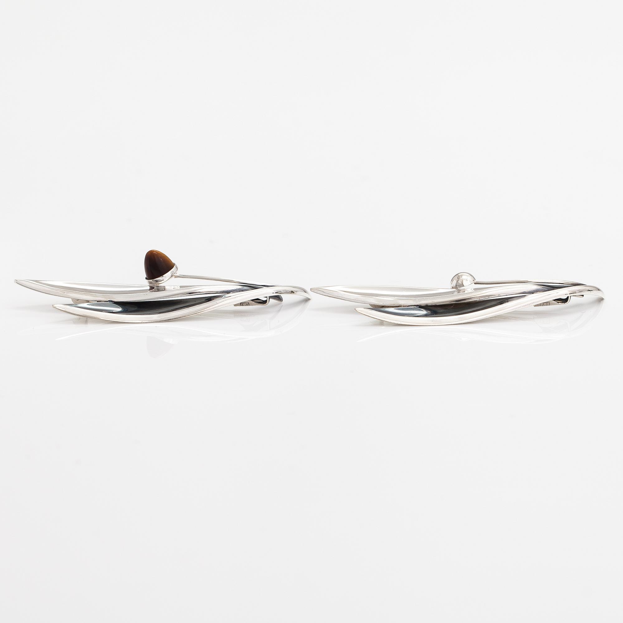 Elis Kauppi, Two silver brooches, one with a tiger's eye. Kupittaan kulta, Turku 1959 and 1962.