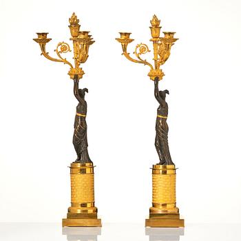 A pair of French Empire four-light candelabra, attributed to Francois Rabiat (bronze maker in Paris 1756-1815).