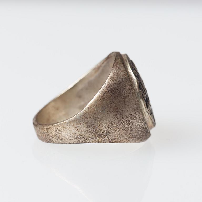 Signet ring, silver, man's profile, Mediterranean region.