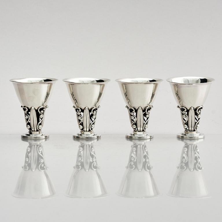 Evald Nielsen, four sterling silver beakers/cups on a foot, Denmark 20th century.