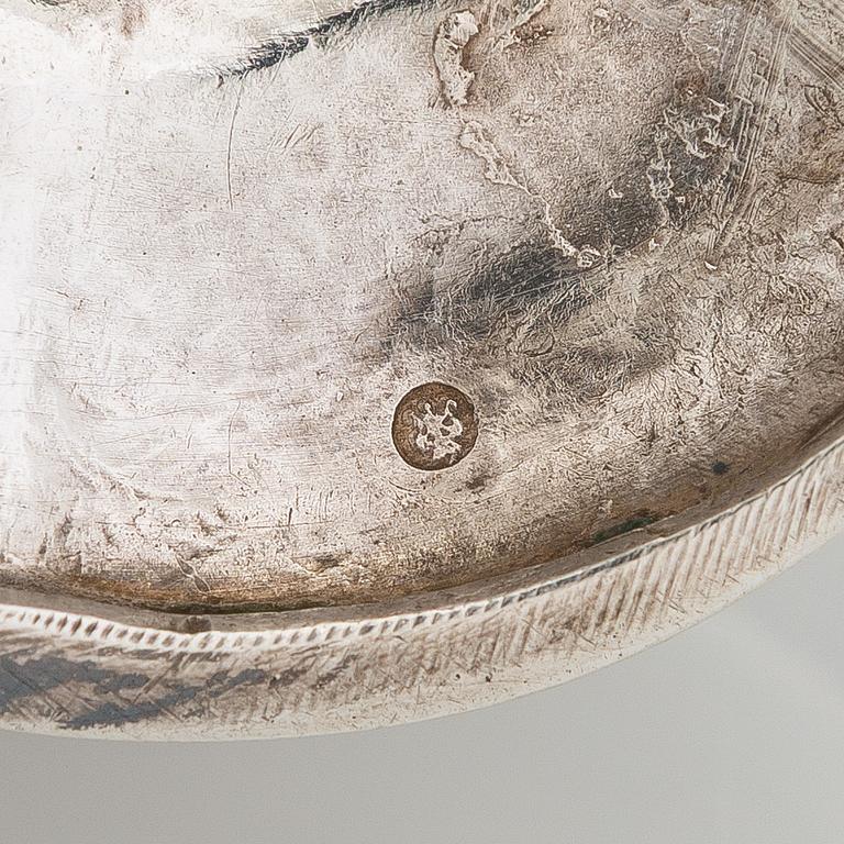 A silver cream jug, maker's mark of Michael Takkinen, St. Petersburg 1856.