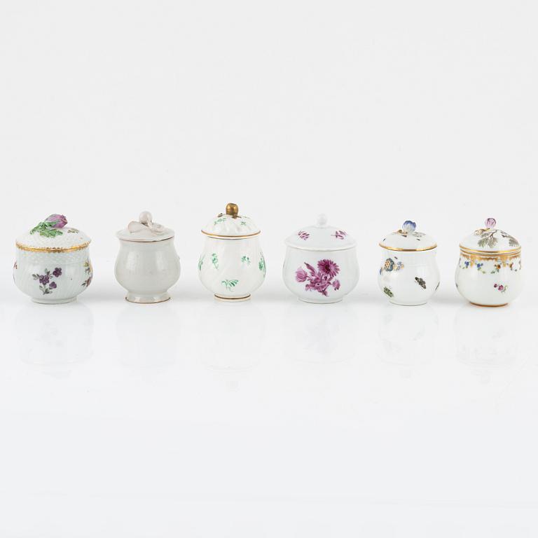 Two dinner plates and 11 custard cups with covers, 18th/20th Century.
