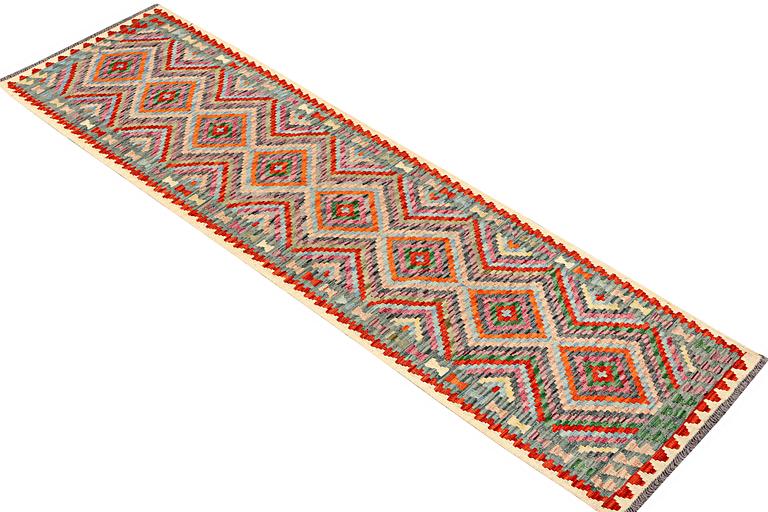 A runner carpet, Kilim, c. 298 x 79 cm.