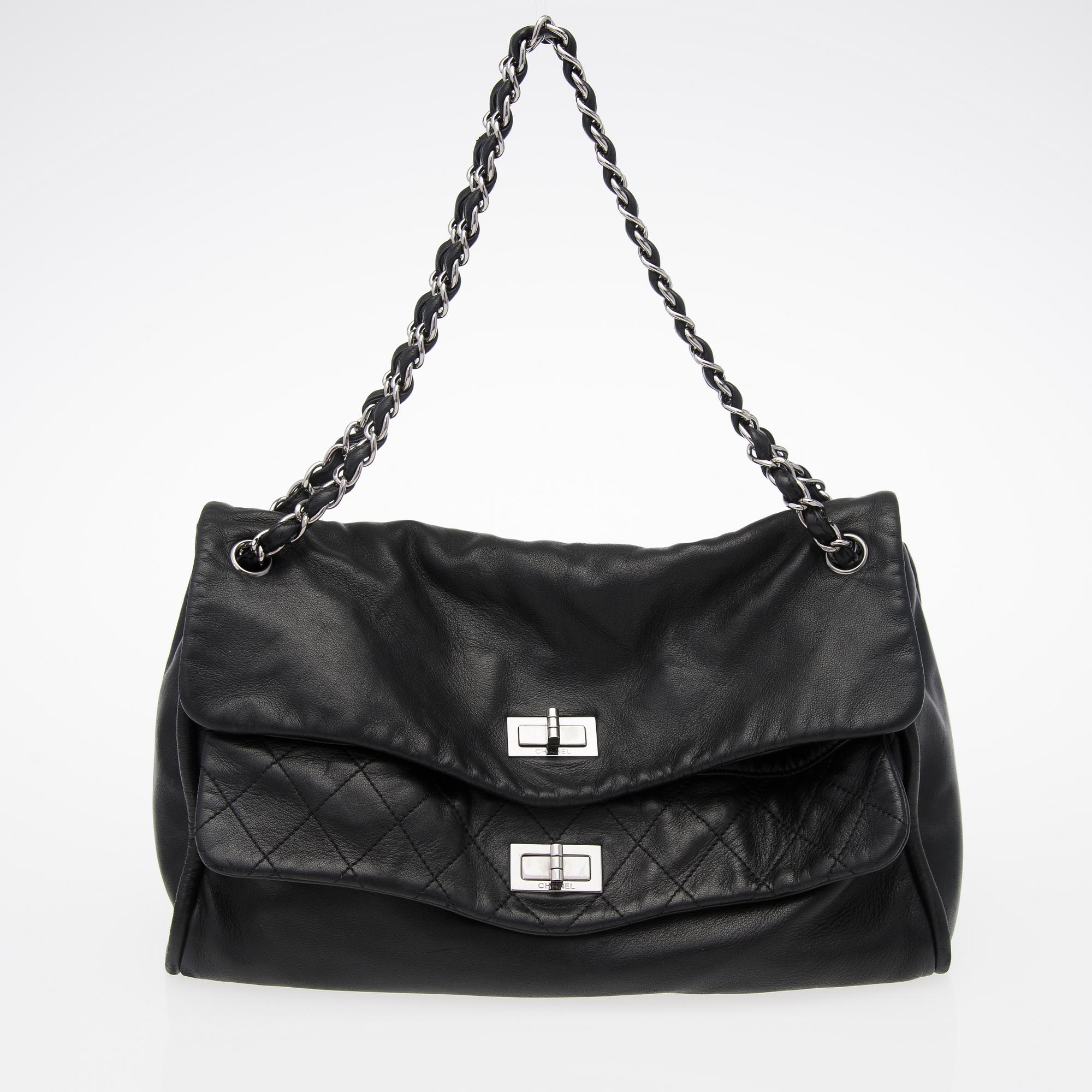A Black Leather Double Mademoiselle Lock Flap Bag.