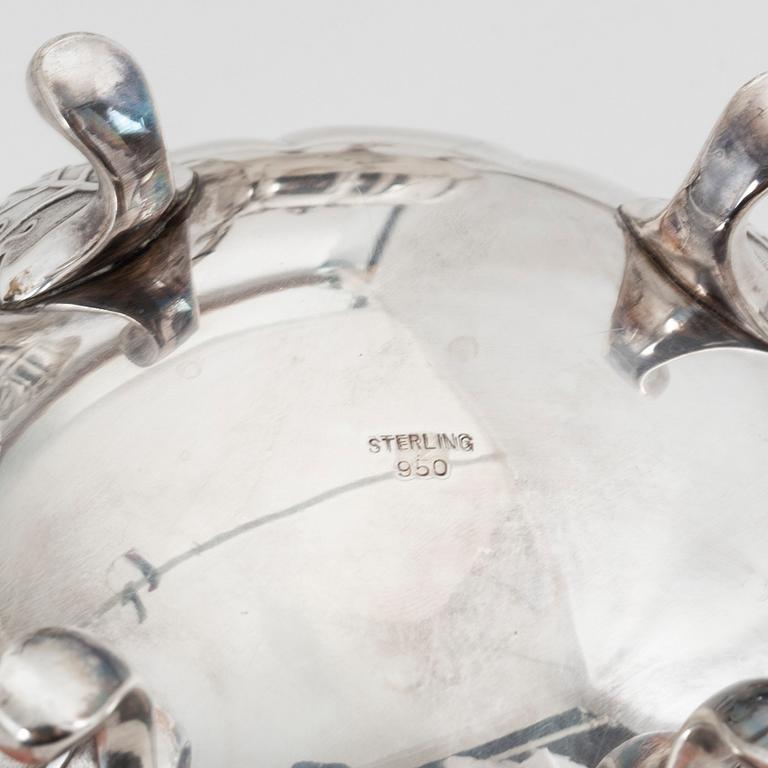 A rococo style sterling silver teapot, coffee pot, creamer and sugar bowl.