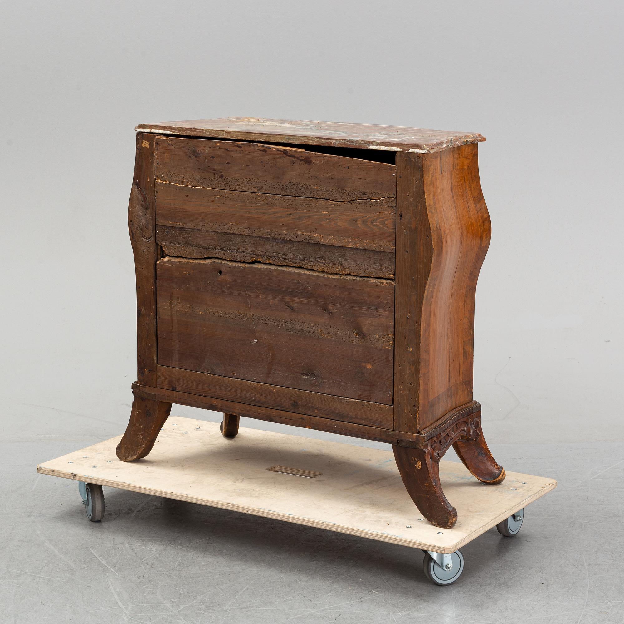 A 19th Century rococo style chest of drawers.