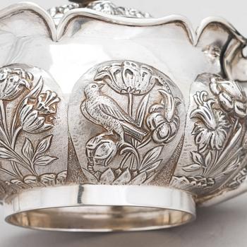 An English 3-piece sterling silver tea set, maker's mark of William Comyns & Sons, London 1892.