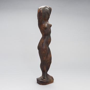 Gunnar Uotila, a wooden sculpture, signed and dated 1950.